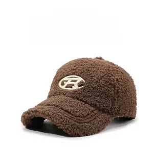 Close-up of brown lamb wool baseball cap featuring white R letter embroidery detail