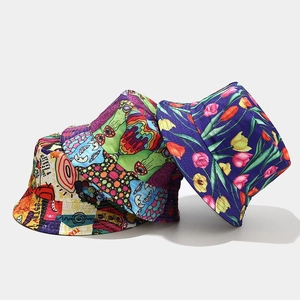 Three bucket hats featuring graffiti, abstract cartoons, and purple tulip floral patterns