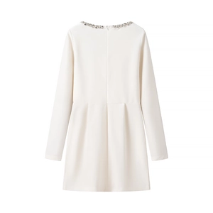 Detailed back view of white velvet dress with beaded neckline and rear zipper closure