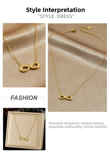 Macro detail of gold infinity necklace with fine chain and adjustable lobster clasp closure