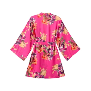 Detailed view of pink floral satin kimono robe with large orchid patterns and matching belt