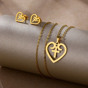 Polished gold stainless steel jewelry set featuring hollow heart pendants with symbols