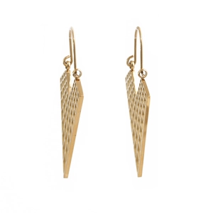 Macro detail of gold-tone triangle earrings with hollow mesh pattern and hook closure
