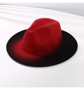 Detailed close-up of the red and black gradient texture on the wool felt fedora hat