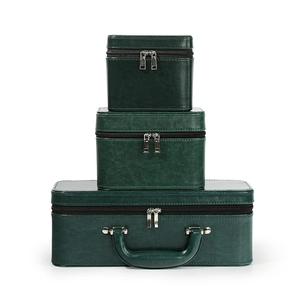Three-piece stackable dark green PU leather jewelry organizer boxes with silver zippers