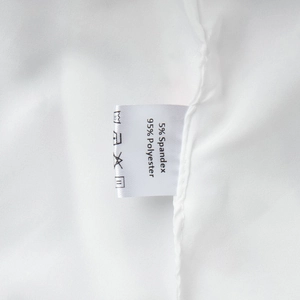 Close-up of garment care label showing 95% polyester and 5% spandex material details