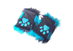 Detail of furry fingerless gloves with black and blue faux fur and glitter paw print