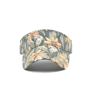 Front view of a sun visor hat with yellow sunflower print and wide brim for sun protection