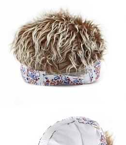 Detail of adjustable velcro strap with letter print and mixed brown synthetic wig hair