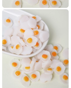 Macro detail of realistic PVC miniature fried eggs for dollhouse DIY craft projects
