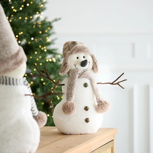 Plush Christmas snowman figurine with brown plaid earflap hat and golden bells decor