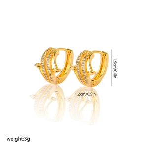 Detail of gold-plated hoop earrings featuring double-row zircon inlay and arrow design