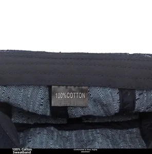 Detail view of cotton sweatband and 100% cotton label inside the denim newsboy cap