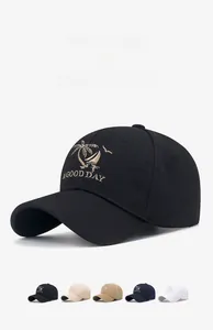 Detail of embroidered palm tree logo and A GOOD DAY text on a cotton baseball cap