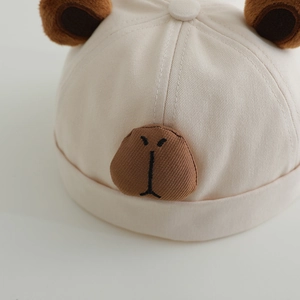 Cute Capybara themed baby brimless docker hat in beige cotton with plush bear ears