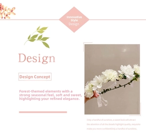 Close-up of white fabric floral bridal headband with green vine base and white ribbons
