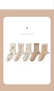 Detail of 5 pairs women's cotton knit socks with floral embroidery and wavy edges