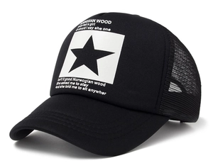 Detail of black mesh trucker hat featuring a white patch with star and text print