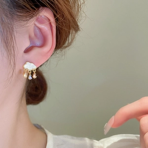 Elegant cloud earrings with zircon waterdrop pendants for women on model wearing ear view