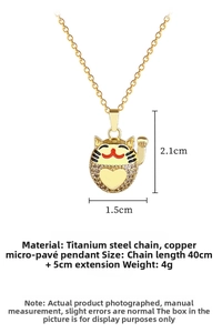 Macro detail of golden Maneki Neko pendant with micro-inlaid crystals and steel chain