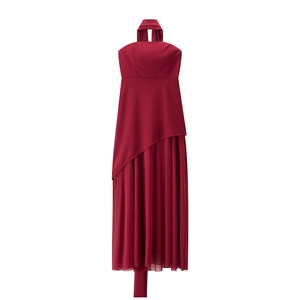 Detail view of burgundy halter neck dress with asymmetric overlay and elegant front slit