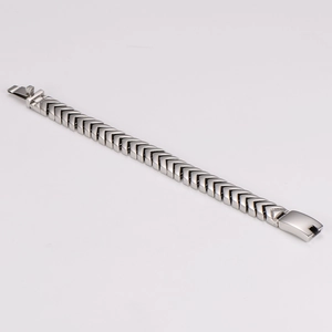 Macro view of polished silver chevron link chain with a secure folding clasp