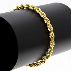 Polished 3mm 18K gold-plated rope chain necklace for men and women on a black display pedestal