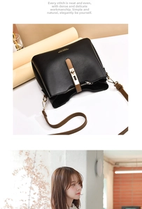 Detail of black bucket bag with brown strap and golden twist lock closure