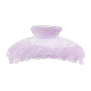 Detail of purple marble hair claw clip with golden glitter in a large acrylic design