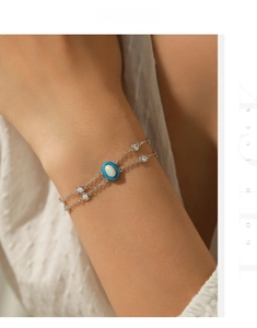 Detailed shot of S925 silver double-layered bracelet with blue enamel and opal stone