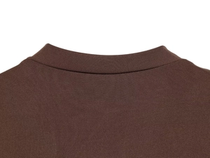 Macro shot of neckline stitching on a brown nylon bodysuit with textured fabric detail