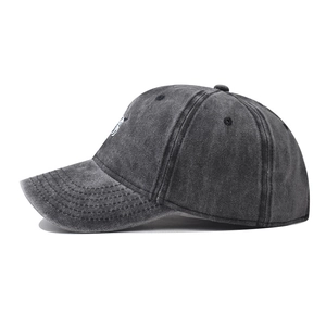 Side view of washed cotton baseball cap featuring vintage distressed texture and eyelets