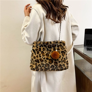 Leopard print faux fur shoulder bag with chain strap and fuzzy pom pom charm