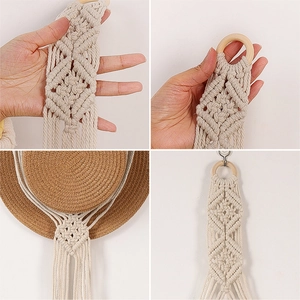 Handmade macrame hat organizer with wooden ring in a bohemian Nordic wall hanging style