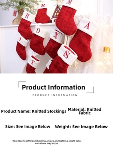 Close-up of red and white knitted Christmas stockings with alphabet letter embroidery