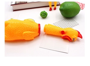 Detail view of the screaming chicken toy showing its functional detachable head design