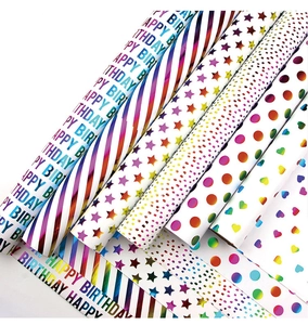 Detail of metallic rainbow gradient gift wrap rolls with various patterns and glossy finish