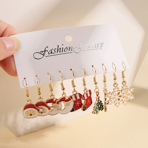 Set of six Christmas enamel earrings featuring Santa Claus, snowflakes and festive trees