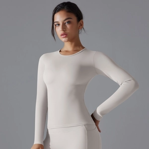 Close-up of light grey slim fit yoga top with seamless texture and round neck detail
