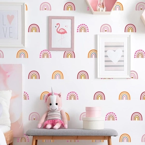 Boho rainbow heart wall decals in warm pink and orange tones for nursery room decoration