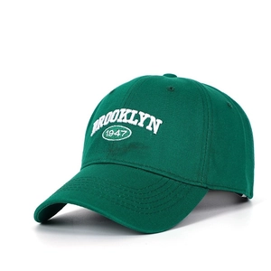Detail of white Brooklyn 1947 3D embroidery on deep green twill cotton baseball cap
