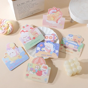 Flat lay of pastel animal greeting cards with cute bear and rabbit illustrations