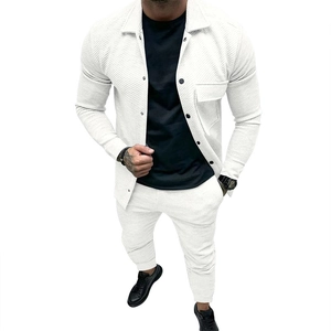 Detailed view of white waffle knit texture on men's casual jacket and pants set