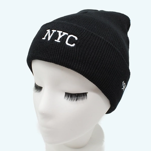 Classic black ribbed knit beanie featuring white NYC embroidery on the fold-over cuff