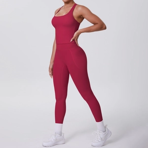 Detail view of dark red yoga set featuring racerback tank top and leggings with side pocket
