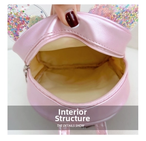 Internal view of pink glitter backpack showing the main compartment and lining