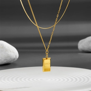 Double-layered gold titanium necklace with shell inlay and a rectangle gold bar pendant