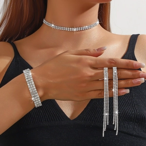 Detailed view of rhinestone jewelry set with layered choker, bracelet, and tassel earrings