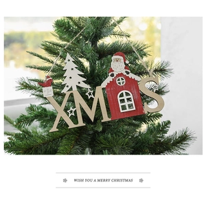 Rustic XMAS wooden letter sign hanging on a Christmas tree with Santa and bird details