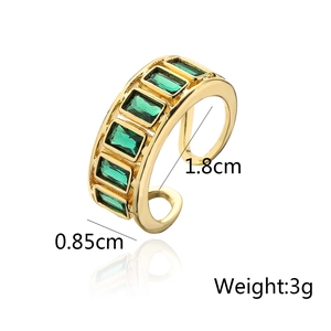 Detail showing 0.85cm width and 1.8cm diameter of gold ring with green zircon